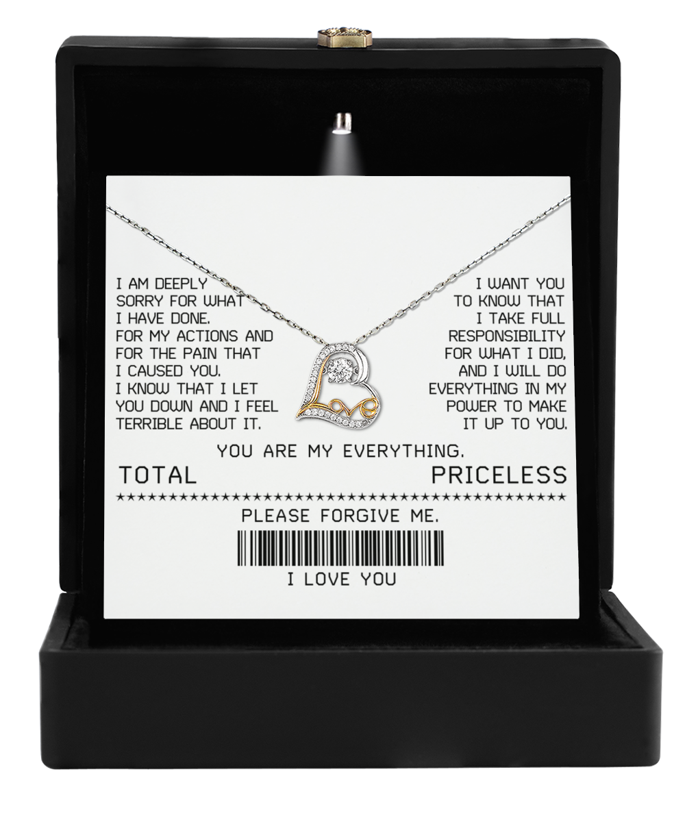 The Sorry-Make It Up - Love Dancing Necklace, crafted in 14k gold with a heart pendant, rests elegantly beside an apology note, tenderly expressing regret and a heartfelt commitment to maternal love.