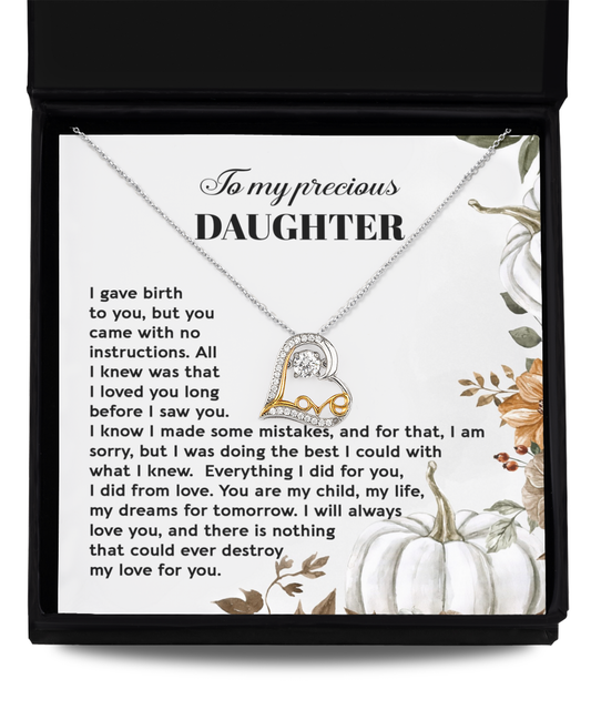 The Daughter-Did From Love - Love Dancing Necklace, a stunning sterling silver piece with a heart-shaped pendant, is elegantly placed on a letter addressed to a daughter. The letter expresses profound love, guidance, and the significance of dreams and forgiveness, all beautifully conveyed through floral illustrations.