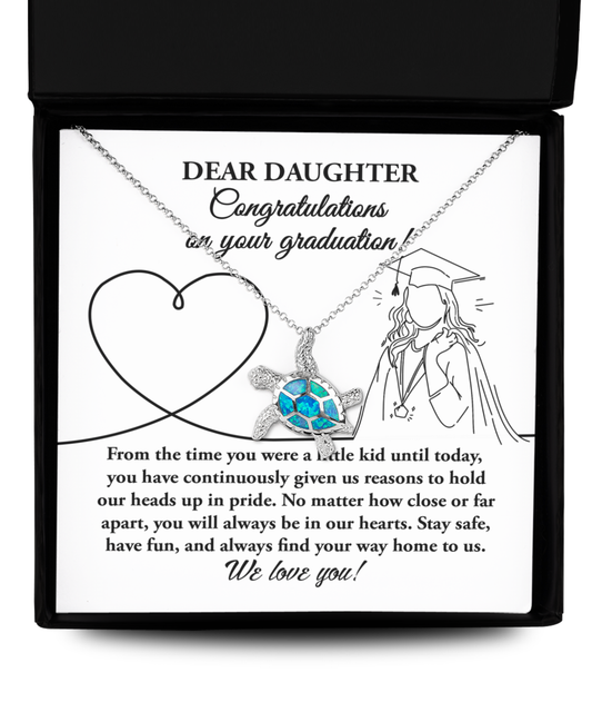 A necklace with a heart pendant and globe design in a box with a graduation congratulatory message for a daughter, featuring the To Daughter, Your Graduation - Opal Turtle Necklace.