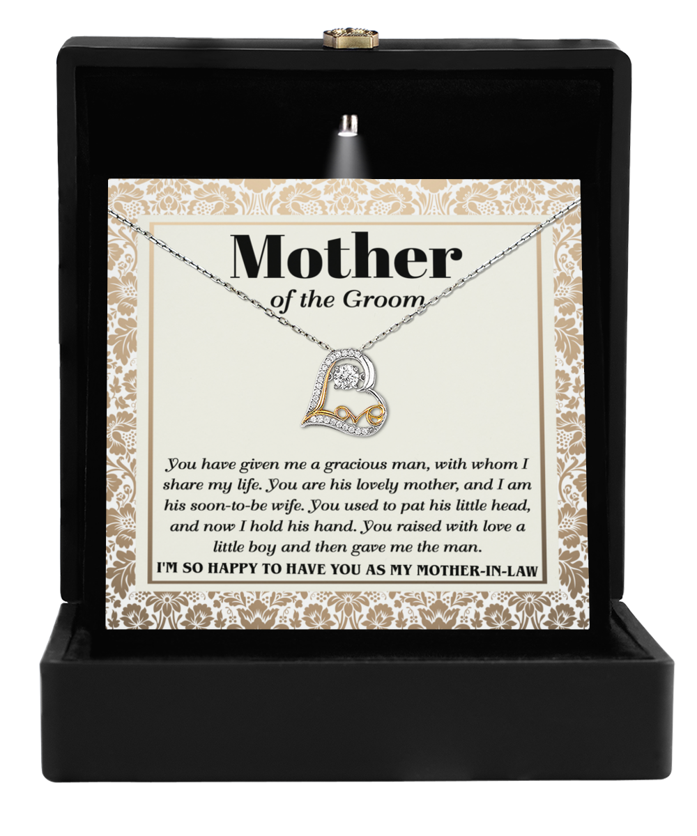 Introducing the Mother-In-Law-To Have You - Love Dancing Necklace: a stunning piece adorned with interlocking circles that embody maternal love. Elegantly presented in a black box, it is accompanied by a heartfelt card labeled "Mother of the Groom," conveying appreciation and love for your beloved Mother-In-Law.