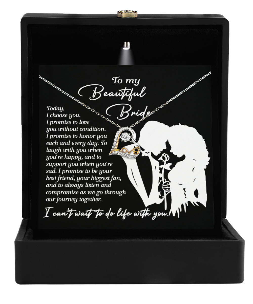 The Bride-I Choose You - Love Dancing Necklace, crafted in 14k gold and presented in a black box with a card titled "To my Beautiful Bride" alongside a romantic silhouette design, makes an ideal gift for the bride.