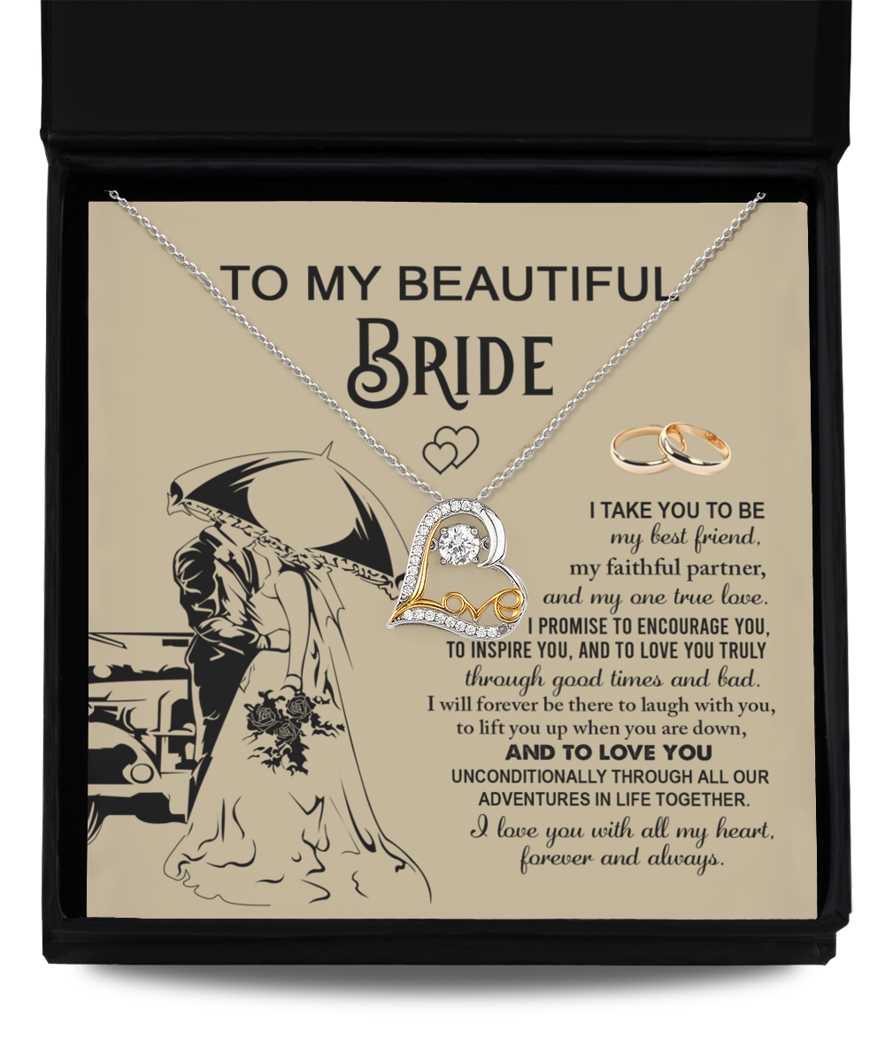 A sterling silver Bride-Faithful Partner - Love Dancing Necklace and two rings are elegantly displayed in a box with a heartfelt message for the bride, featuring vows of love, support, and encouragement. The illustration of a couple under an umbrella adds a romantic touch.