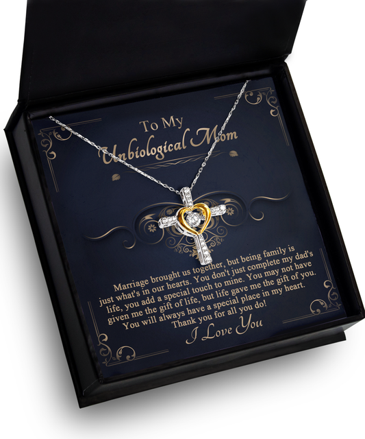 A necklace with a To Unbiological Mom, In Our Hearts - Cross Dancing pendant in an open gift box featuring a personalized message to a stepmother, crafted from 14k gold-plated material.