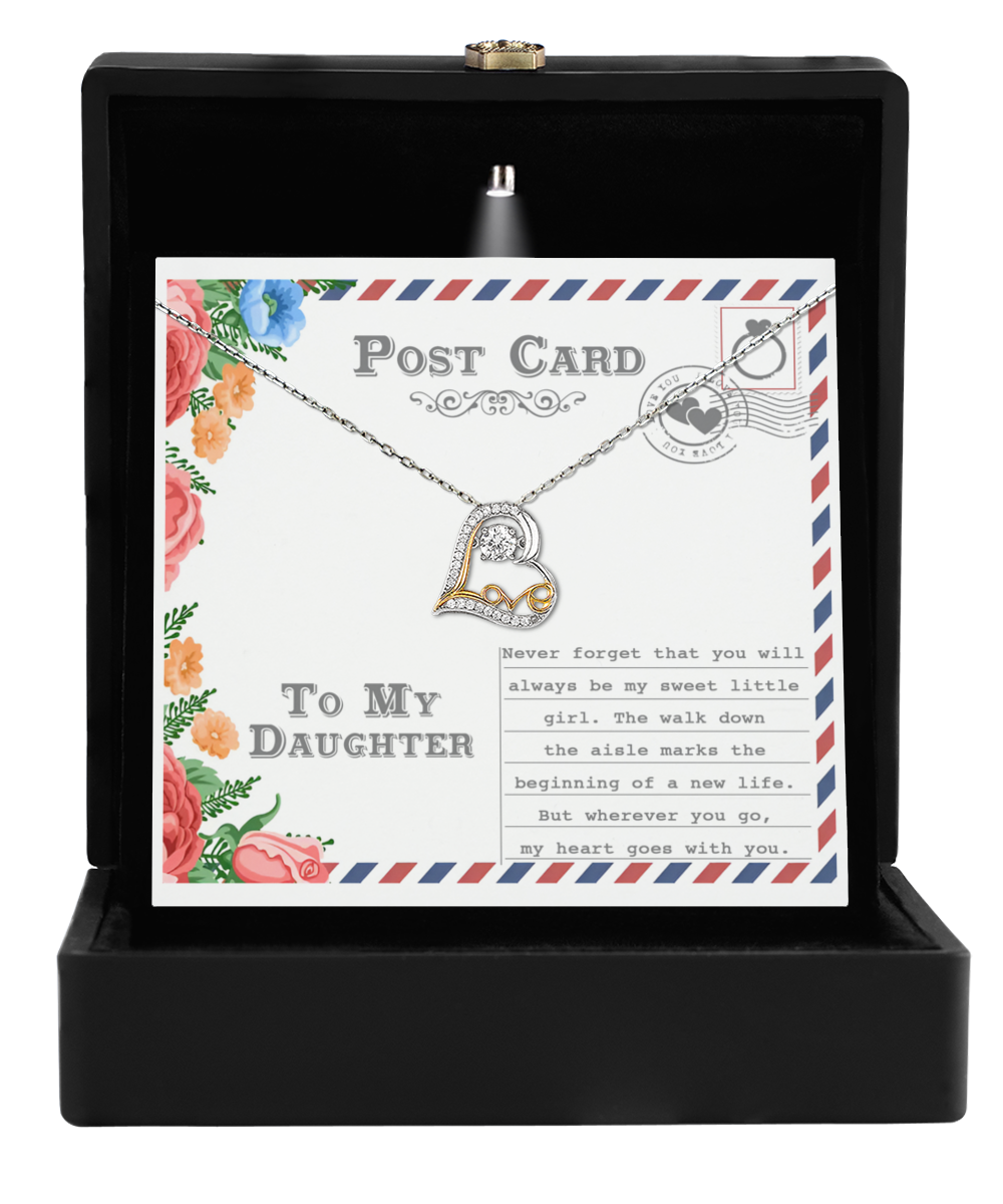 Displayed in an open black box is the "To Daughter-Goes With You - Love Dancing Necklace," featuring a 14k gold heart pendant. Accompanied by a card that reads, "To My Daughter," it includes a heartfelt message, making it an ideal personalized gift.