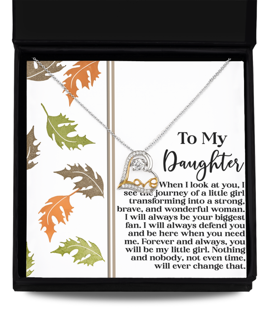 The Daughter-Biggest Fan - Love Dancing Necklace, crafted from .925 sterling silver, is beautifully presented in a gift box featuring autumn leaf designs, along with a note that says "To My Daughter" accompanied by a heartfelt message.