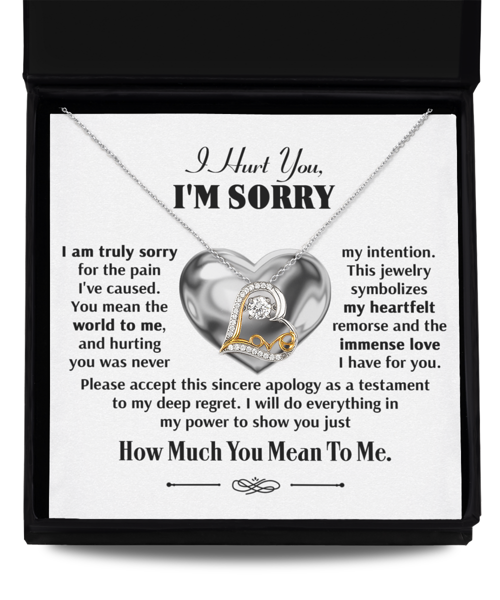 The Sorry-Sincere Apology - Love Dancing Necklace, featuring a heart pendant, is elegantly presented in an open box. Crafted from sterling silver, it is accompanied by a heartfelt apology note that conveys deep remorse for any pain caused and underscores the recipient's importance.