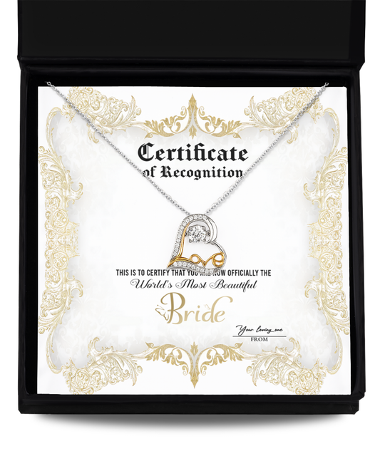 An open black box containing a Bride-Certificate Of Achievement - Love Dancing Necklace and a certificate. The certificate reads, "Certificate of Recognition. World's Most Beautiful Bride," and has a gold decorative border.