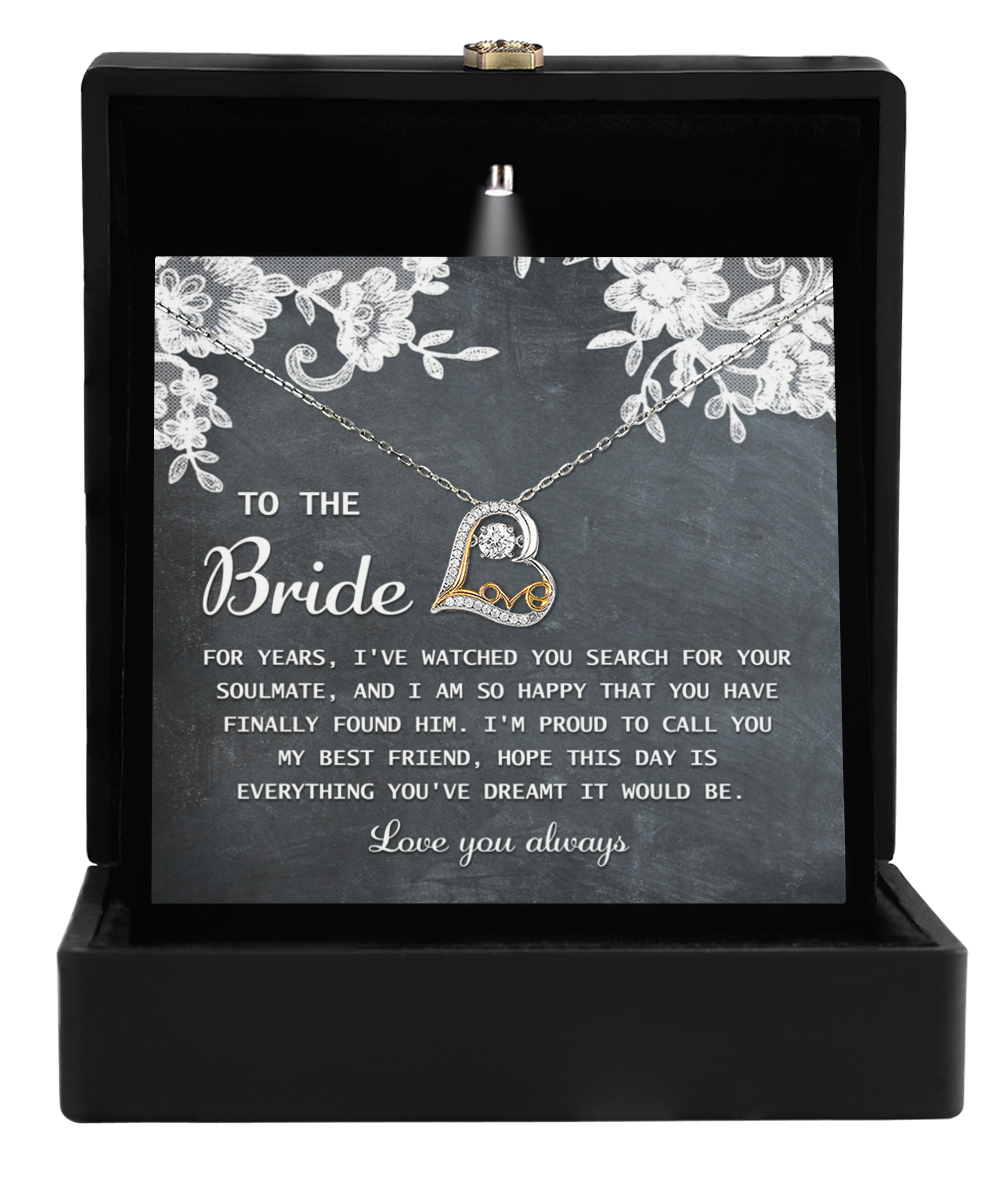 The exquisite To Bride-My Best Friend - Love Dancing Necklace showcases a heart-shaped pendant, beautifully packaged in a gift box with a touching message for the bride.