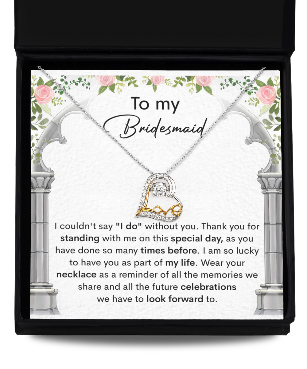 A bridesmaid thank you card adorned with floral designs, featuring the Bridesmaid-Standing With Me - Love Dancing Necklace. The card expresses gratitude for the bridesmaid's support and looks forward to future celebrations.