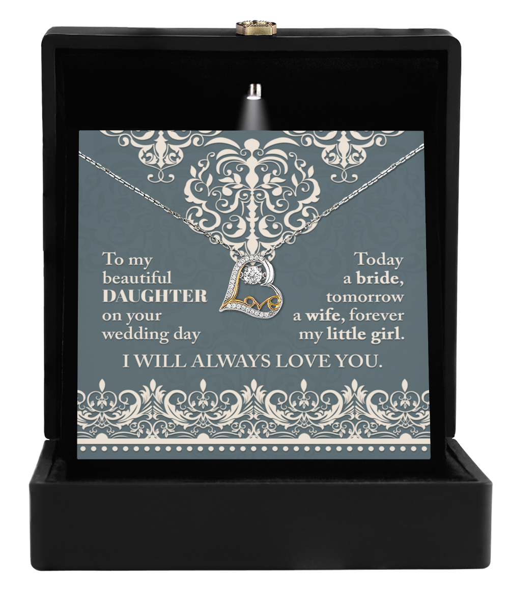 The Love Dancing Necklace, featuring a heart pendant in an open box, is accompanied by the heartfelt message: "To my beautiful daughter on your wedding day, I will always love you. Today a bride, tomorrow a wife, forever my little girl." A timeless gift for your daughter's wedding day that symbolizes lasting maternal love.