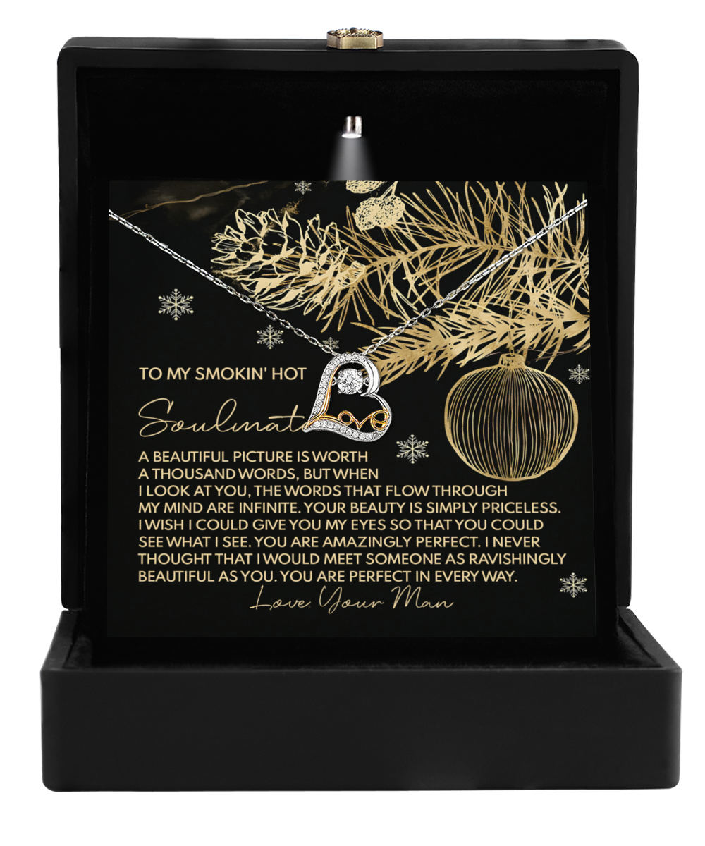 Inside the black gift box, you'll find the "Soulmate-Amazingly Perfect - Love Dancing Necklace." The lid highlights a decorative card adorned with gold holiday motifs and a romantic message: "To my smokin' hot soulmate... Love, Your Man." Opt for either 14k Gold or Sterling Silver to add that perfect touch of elegance.