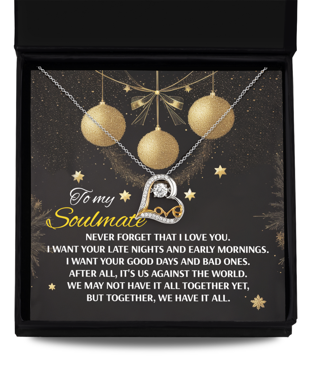 A heart-shaped "Soulmate-Have It All- Love Dancing Necklace" shines on a black card featuring a heartfelt message about love and togetherness. This exquisite piece, adorned with 14k gold ornaments and star designs, beautifully combines elegance with sentiment.