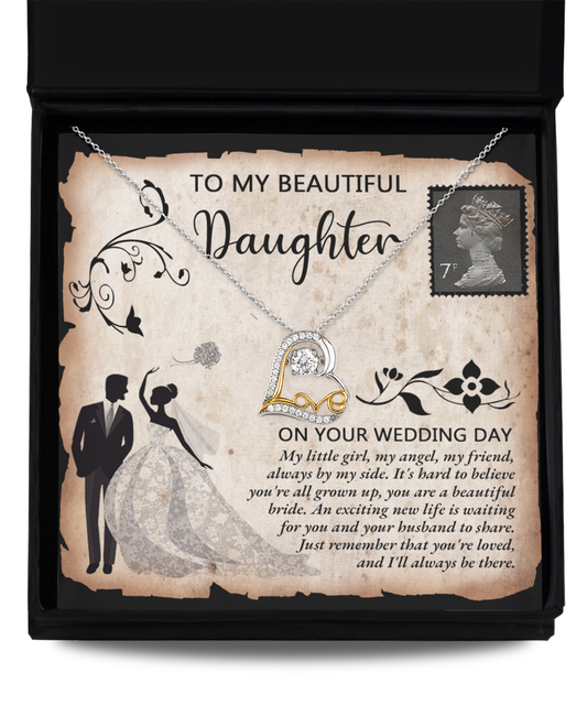 A Daughter Wedding-Beautiful Bride - Love Dancing Necklace featuring a heart-shaped pendant sits elegantly in a gift box with a heartfelt message for a daughter on her wedding day. Crafted from 14k gold, the necklace is accompanied by an illustration of a bride and groom within a decorative border.