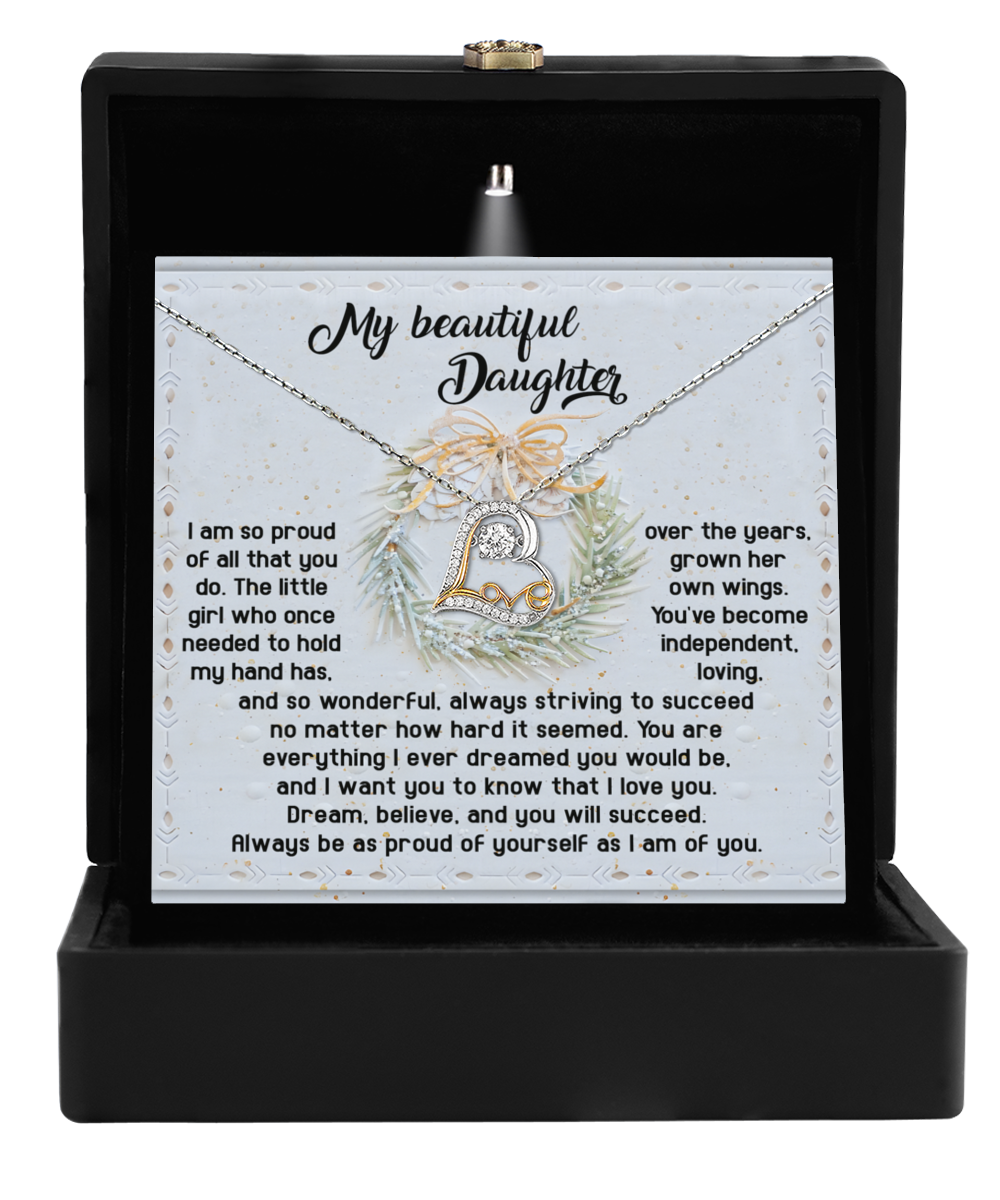 The Daughter-Proud Of Yourself - Love Dancing Necklace, featuring a heart and infinity symbol, comes elegantly packaged in a sleek black box. Made from 14k gold, it includes a touching message for a daughter that conveys pride, love, and encouragement.