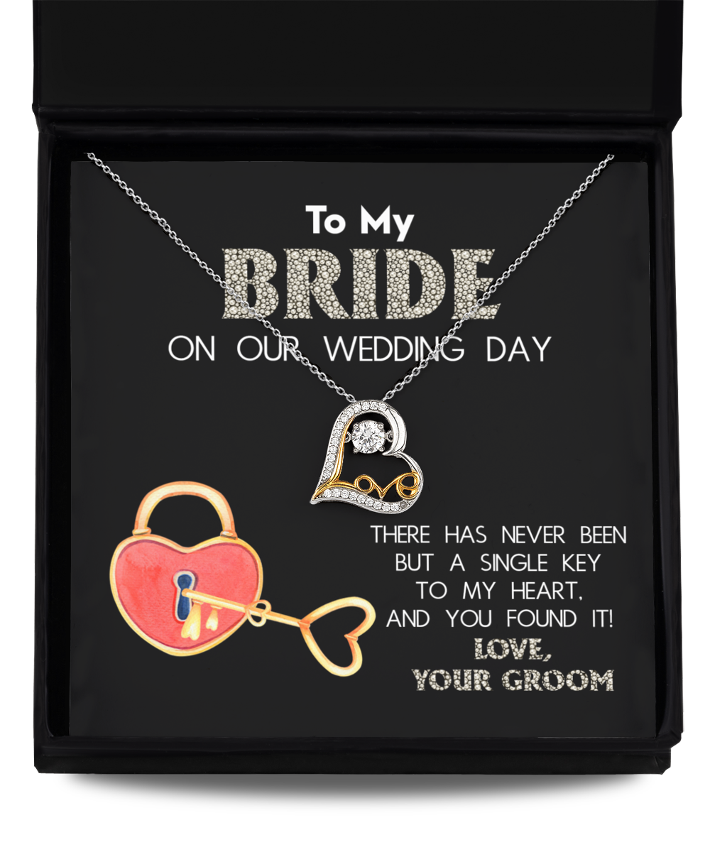 A wedding gift Bride-A Single Key - Love Dancing Necklace with a heart-shaped pendant made of .925 Sterling Silver, presented in a box. The inscription reads: "To My Bride on our Wedding Day. There has never been but a single key to my heart, and you found it! Love, Your Groom.