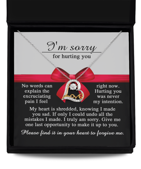 The "Sorry-Made You Sad - Love Dancing Necklace," a sterling silver creation with a heart pendant, is elegantly presented in a box. An accompanying printed apology message expresses sincere regret and seeks forgiveness, capturing the heartfelt sentiment of this love-themed necklace.