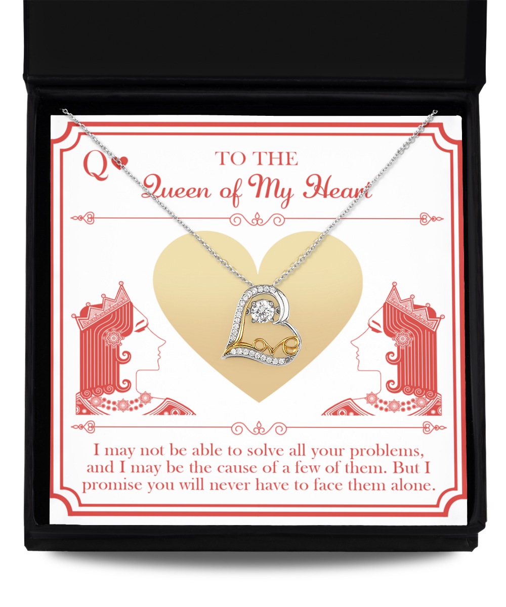 The "To Wife-The Queen - Love Dancing Necklace," a .925 Sterling Silver necklace with a heart-shaped pendant adorned with diamonds, is elegantly displayed in an open black box. The background card features two red queen silhouettes facing each other and a gold heart in the center alongside the message: "To the Queen of My Heart." Additional sentimental text is included below.