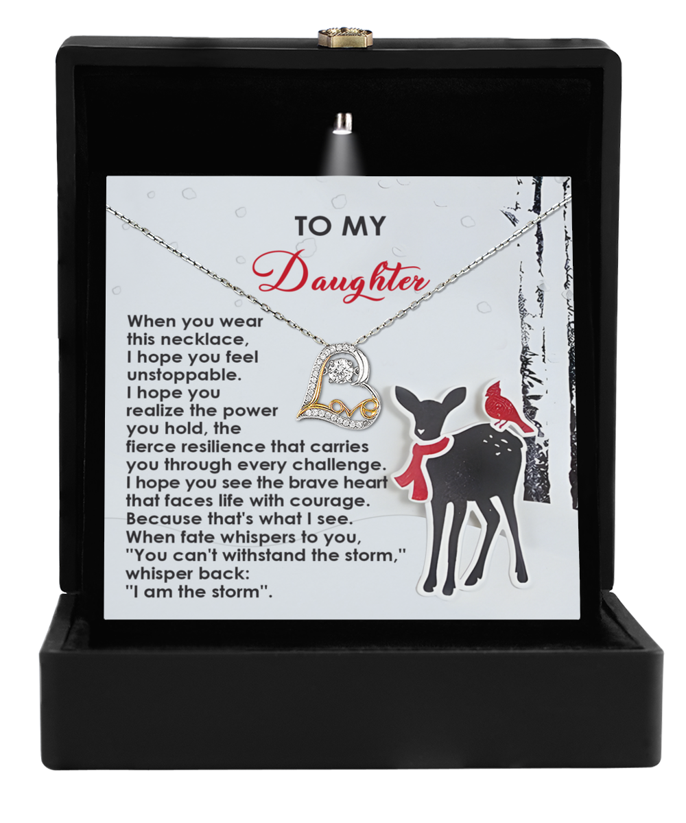 The Daughter-Every Challenge - Love Dancing Necklace, featuring a heart pendant, is beautifully packaged in a black box. The box includes a card with the message "To My Daughter" alongside an illustration of a deer and a cardinal on a tree branch, making it an exquisite gift for those who appreciate 14k Gold or Sterling Silver.