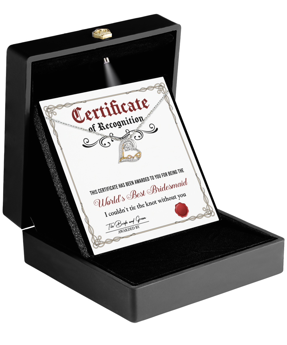 Open black box showcasing a "To Bridesmaid, Certificate Of Recognition" alongside the exquisite Love Dancing Necklace, a heart-shaped pendant that makes the perfect keepsake for any bridesmaid.