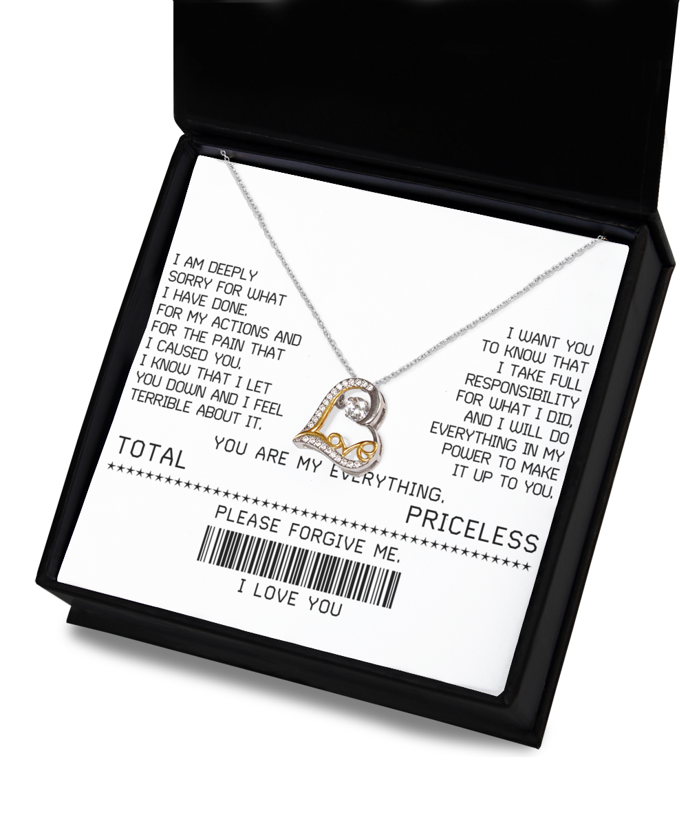 A Sorry-Make It Up - Love Dancing Necklace features an interlocking heart pendant on a white card with an apology message and phrases such as "YOU ARE MY EVERYTHING" and "PLEASE FORGIVE ME" printed in black text.