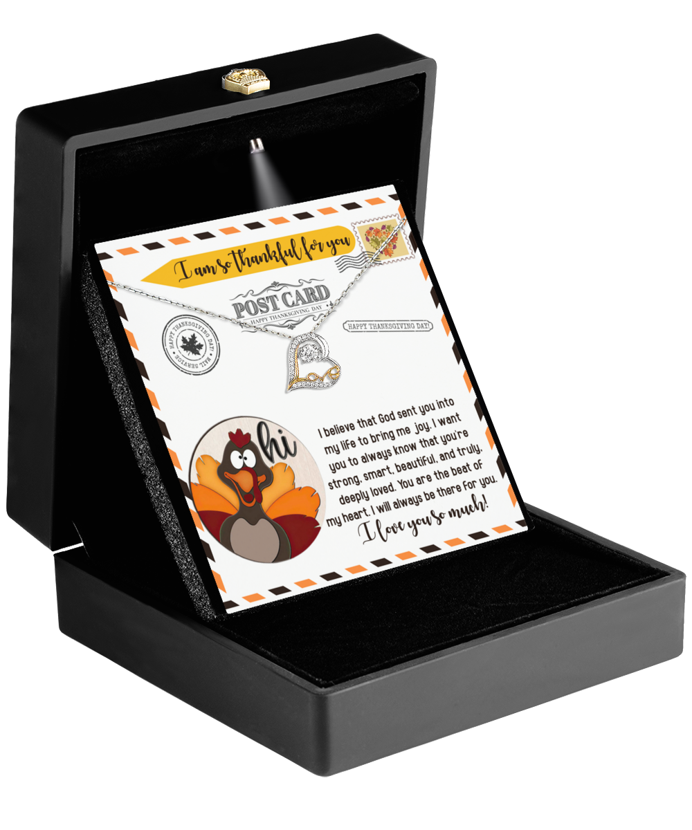 Open the black box to reveal a Thanksgiving-The Beat - Love Dancing Necklace and a sentimental note with a turkey illustration that expresses gratitude and affection. This sterling silver heart necklace embodies the essence of heartfelt connections with its elegant design.