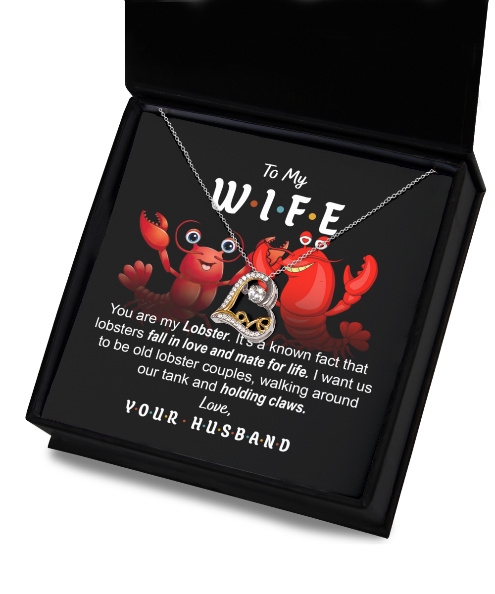 A box with a lobster-themed necklace crafted in .925 Sterling Silver and a message that reads: "To My W.I.F.E. You are my Lobster. Love, Your Husband." The background shows cartoon lobsters contains the Wife-Old Lobster Couples - Love Dancing Necklace.