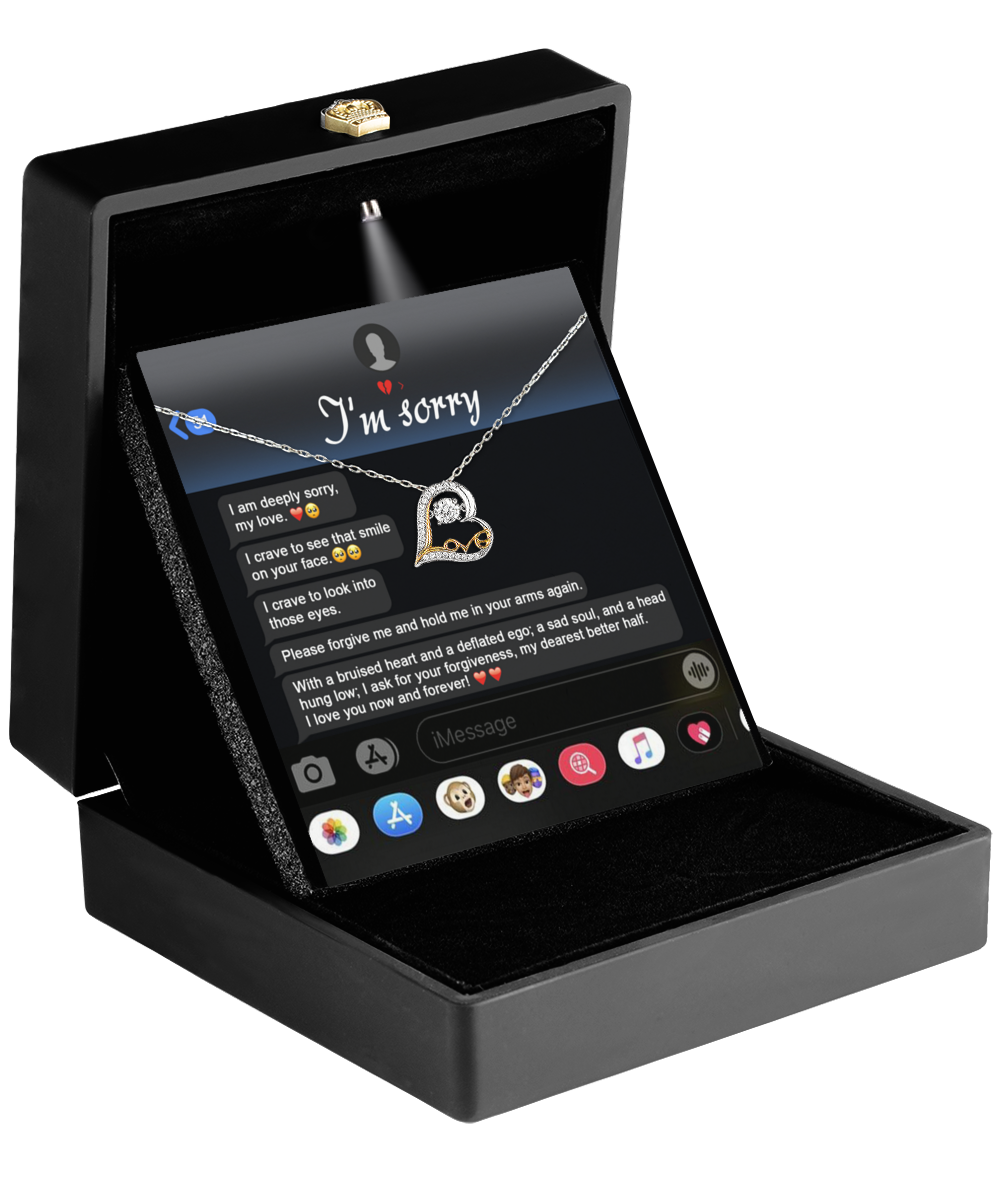 The Sorry-Rebuild Our Connection - Love Dancing Necklace comes in a black box with a heart-shaped pendant. The lid displays "I'm sorry" next to a smartphone chat screen, making it an ideal gift for your wife.