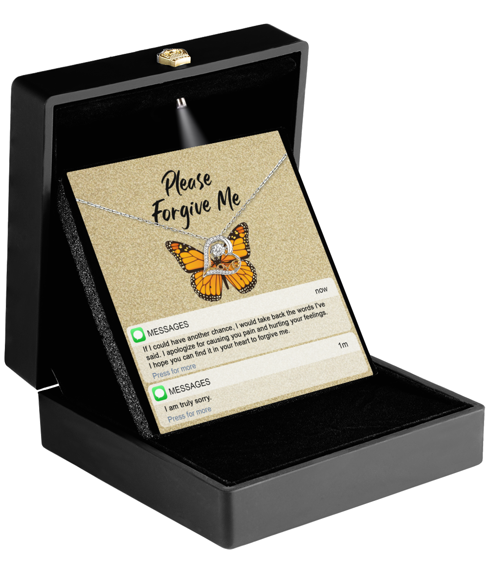 The Sorry-In Your Heart - Love Dancing Necklace, in a black box with a butterfly pendant, comes with a heartfelt card inside the lid reading "Please Forgive Me.