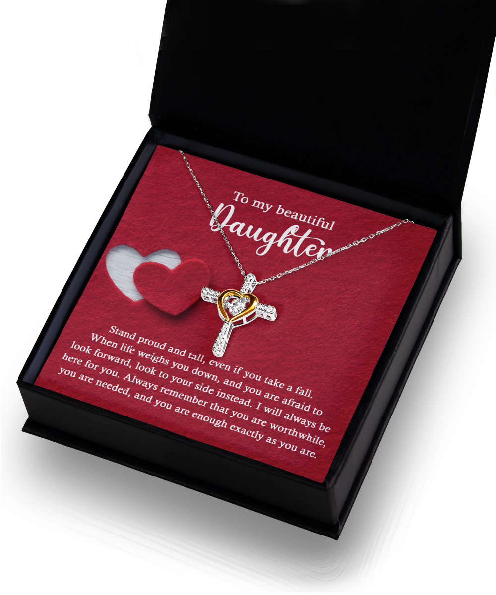 An open black box reveals the stunning "To Daughter-As You Are - Cross Dancing Necklace," featuring a heart intertwined with a cross in 14k gold. The box also includes an inspirational message addressed to a daughter.