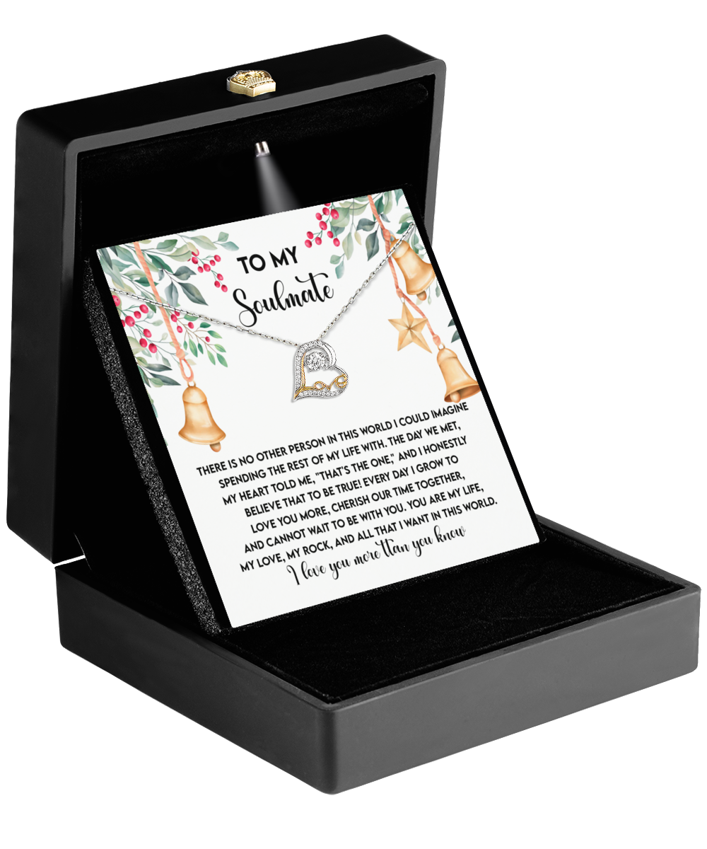 The Soulmate-Be With You - Love Dancing Necklace, featuring a heart pendant and crafted in sterling silver, is elegantly presented in a black box. It comes with a card that has a decorative border and bears the message "To My Soulmate," expressing your deepest emotions.