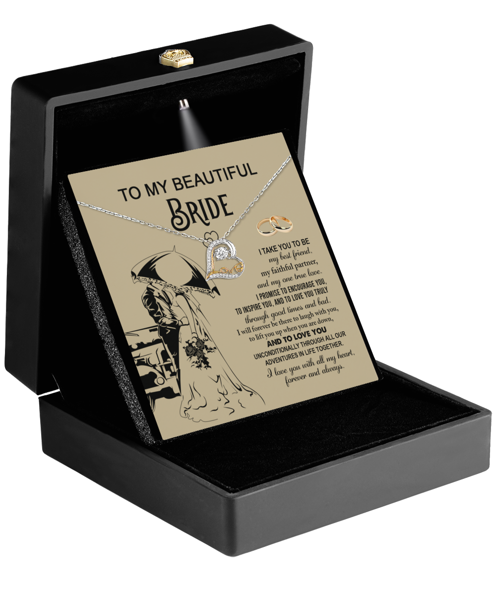 The Bride-Faithful Partner - Love Dancing Necklace, which features a heart pendant, arrives in a black box and includes a card titled "To My Beautiful Bride." The card displays a romantic message alongside the silhouette of a couple dancing in love.