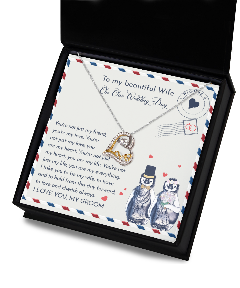 A To Wife Wedding, Love And Cherish - Love Dancing Necklace with a heart-shaped pendant in .925 Sterling Silver, presented in a box featuring a heartfelt message to a wife on their wedding day, accompanied by an illustration of two penguins dressed as bride and groom.