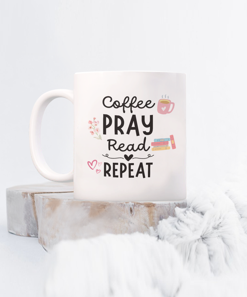 The "Coffee Pray Read Repeat Coffee Mug" features a coffee cup, flowers, and books, set on wood and white fur. This USA printed exclusive gift for readers isn't sold in stores.