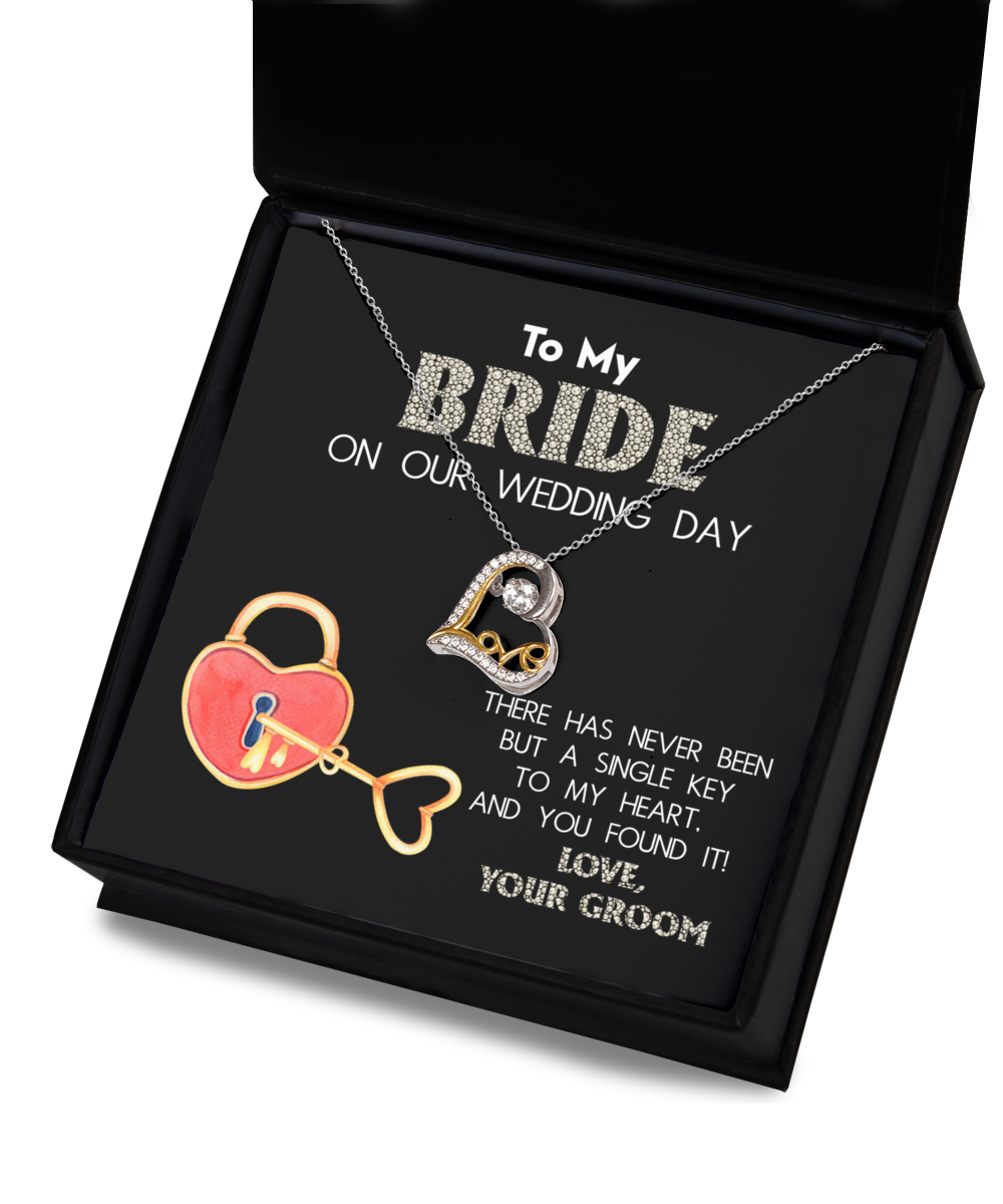 A wedding gift Bride-A Single Key - Love Dancing Necklace with a heart-shaped pendant made of .925 Sterling Silver, presented in a box. The inscription reads: "To My Bride on our Wedding Day. There has never been but a single key to my heart, and you found it! Love, Your Groom.