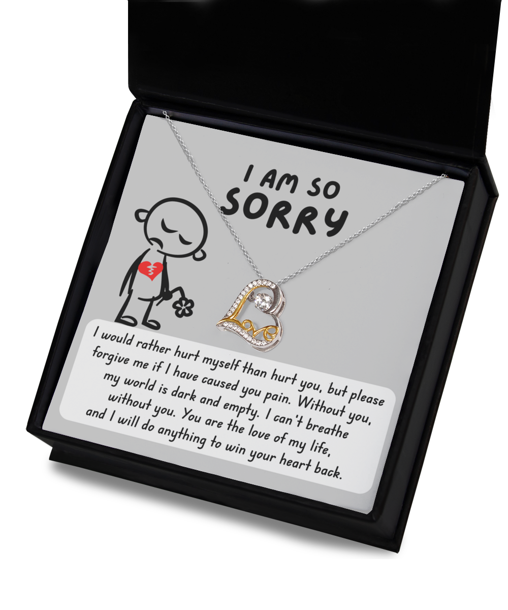 The Sorry-Dark And Empty - Love Dancing Necklace, a heart-shaped sterling silver pendant, comes in an open gift box accompanied by an apology note featuring a cartoon character holding a flower, expressing regret and the desire to make amends.