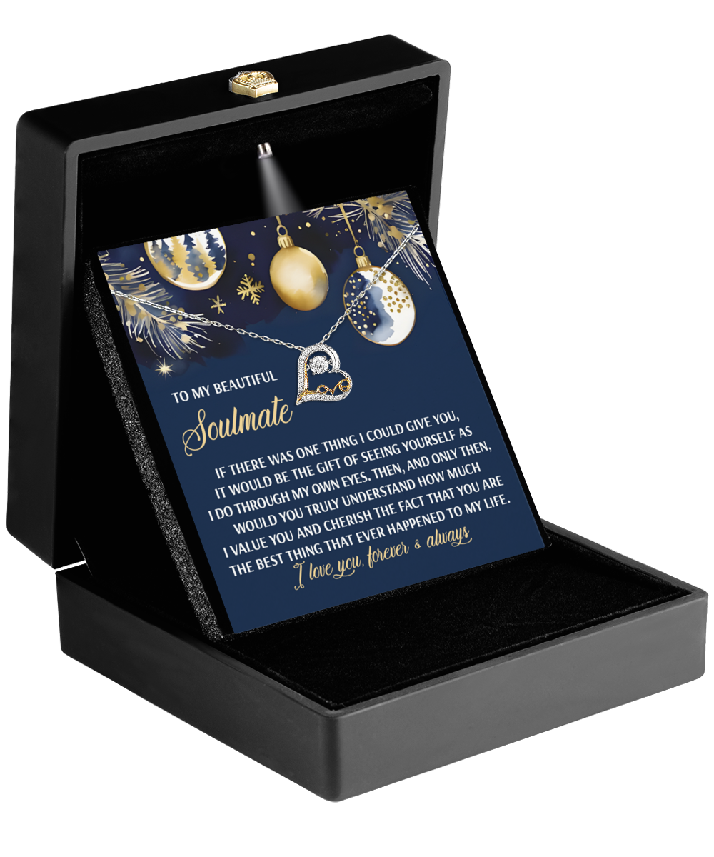 A black box displays a card adorned with gold and blue decorative elements, conveying a heartfelt message of love and appreciation for a soulmate, beautifully paired with the Soulmate-One Thing - Love Dancing Necklace made from rhodium-plated sterling silver.