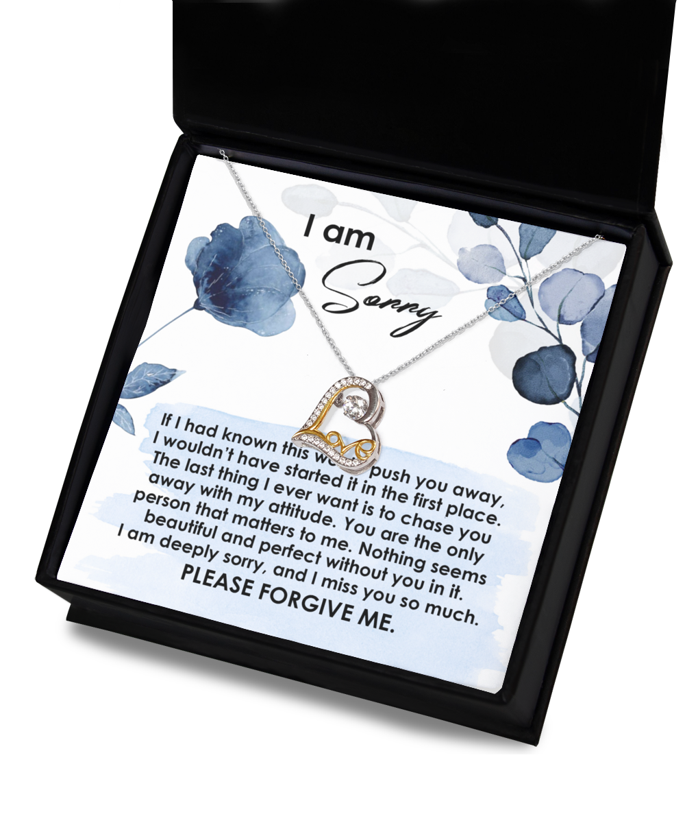 The "Sorry-Push You Away - Love Dancing Necklace" is a heart-shaped pendant crafted in .925 Sterling Silver, presented in an open gift box with a sentimental apology message. The message expresses deep regret and asks for forgiveness, making this necklace a truly heartfelt gesture that speaks volumes.