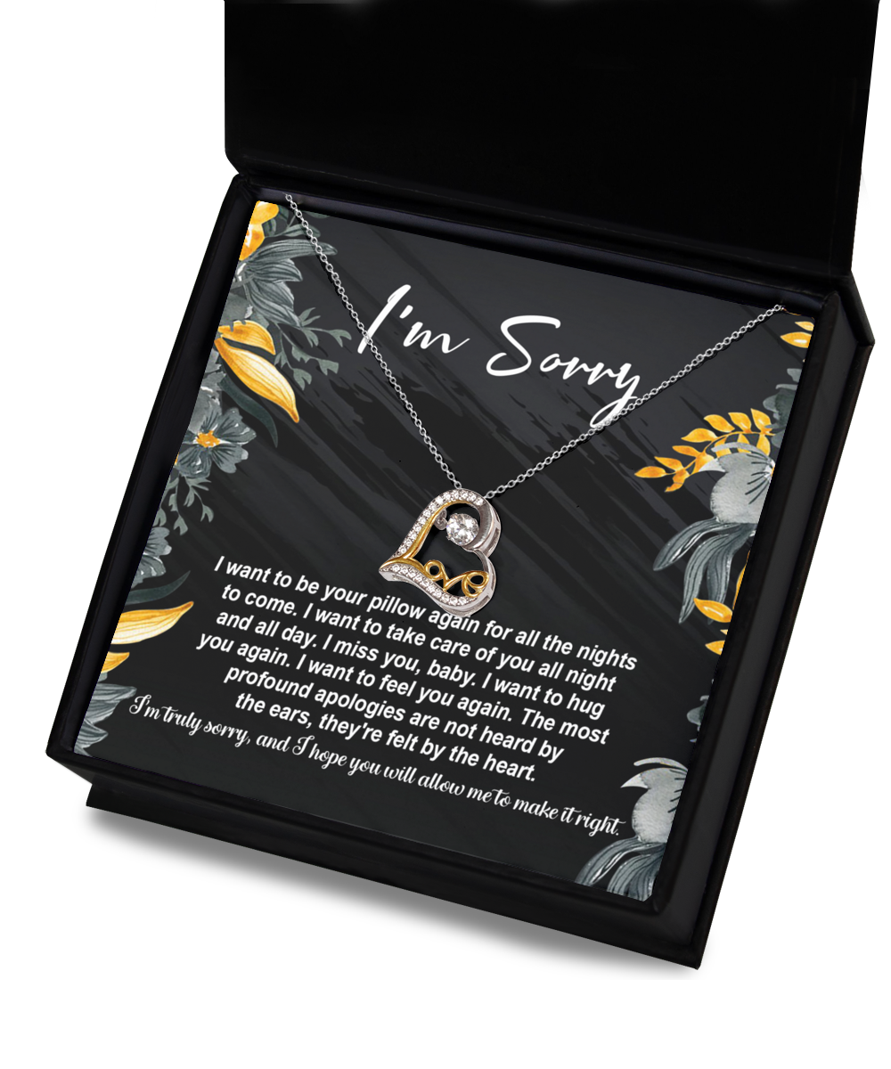 The Sorry-Be Your Pillow - Love Dancing Necklace features a 14k gold necklace with a heart-shaped pendant, elegantly presented in a box alongside an apology note that reads "I'm Sorry," accompanied by a heartfelt message expressing how much you miss and want to comfort the recipient. This exquisite piece beautifully combines elegance and sentiment.