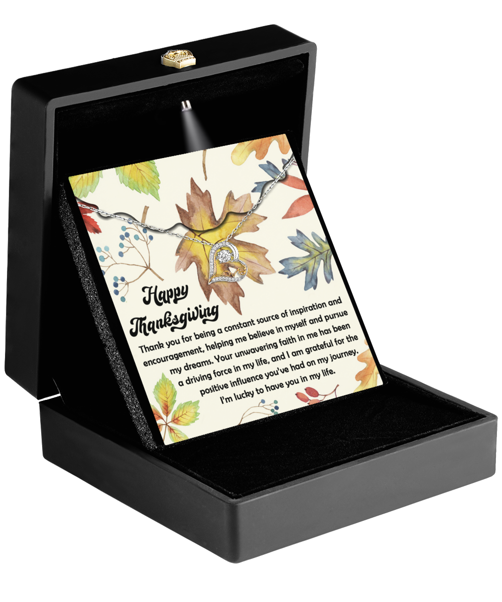 An open black jewelry box displaying the Sterling Silver "Thanksgiving-On My Journey - Love Dancing Necklace" alongside a floral card.