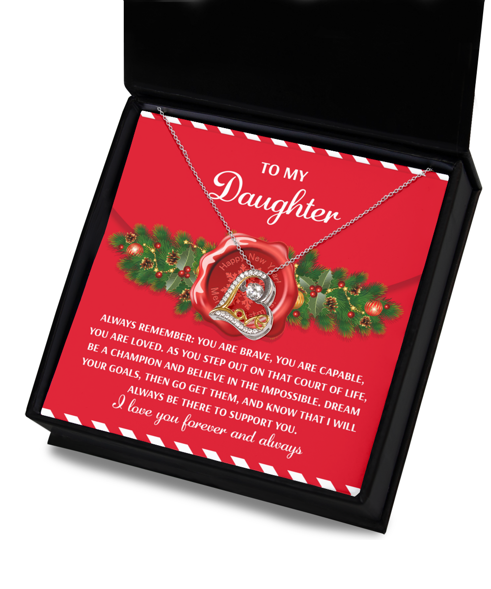 A gift box with the Daughter-Be A Champion - Love Dancing Necklace, featuring a heart-shaped pendant and an inspirational "To My Daughter" message card.