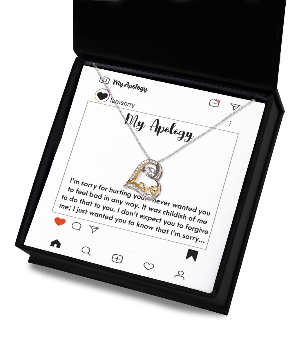 A Sorry-My Apology - Love Dancing Necklace, featuring a silver and gold .925 Sterling Silver pendant, is beautifully set on an Instagram-themed card with a heartfelt apology message. The entire presentation comes in a black gift box with "My Apology" elegantly inscribed on the card.