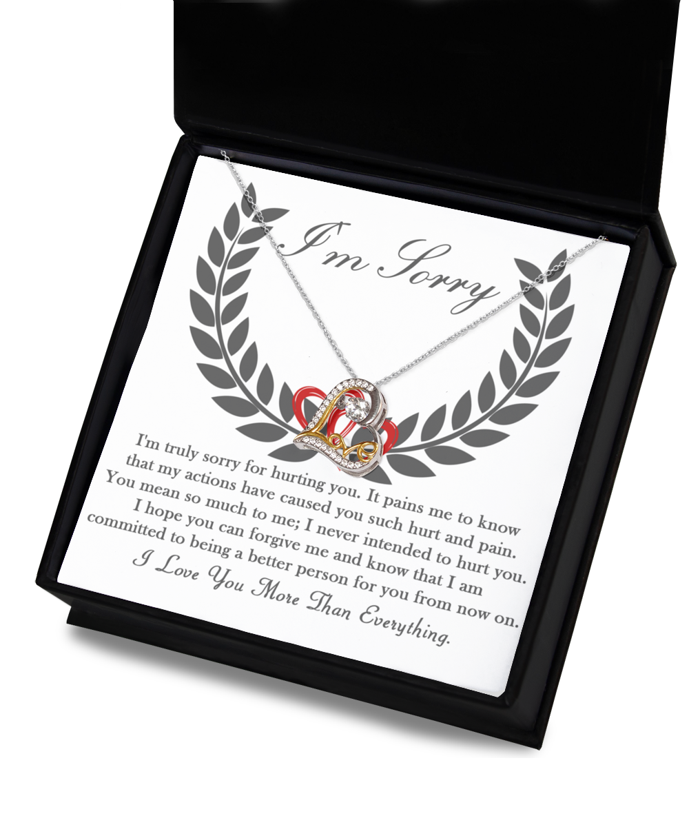 Displayed in an open box, the "Sorry-From Now On - Love Dancing Necklace," made of genuine Sterling Silver, features a heartfelt message inside. The note begins with "I'm Sorry" and continues with an apology and a pledge to change, concluding with the touching sentiment, "I Love You More Than Everything.