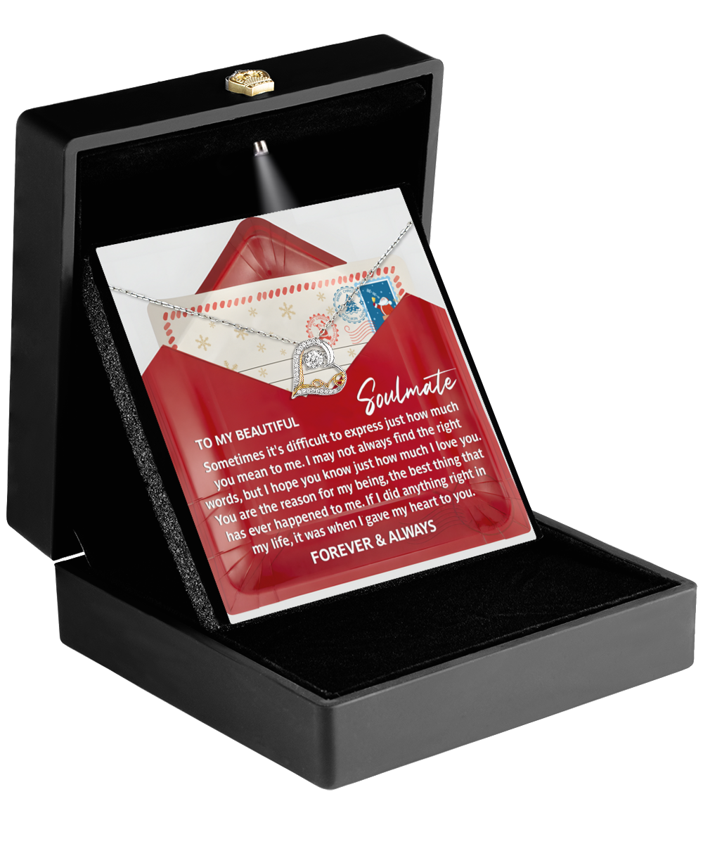 The Soulmate-Right Words - Love Dancing Necklace, presented in a black jewelry box with a romantic letter theme, is crafted from sterling silver and includes a card that reads "To My Beautiful Soulmate," along with a heartfelt message.