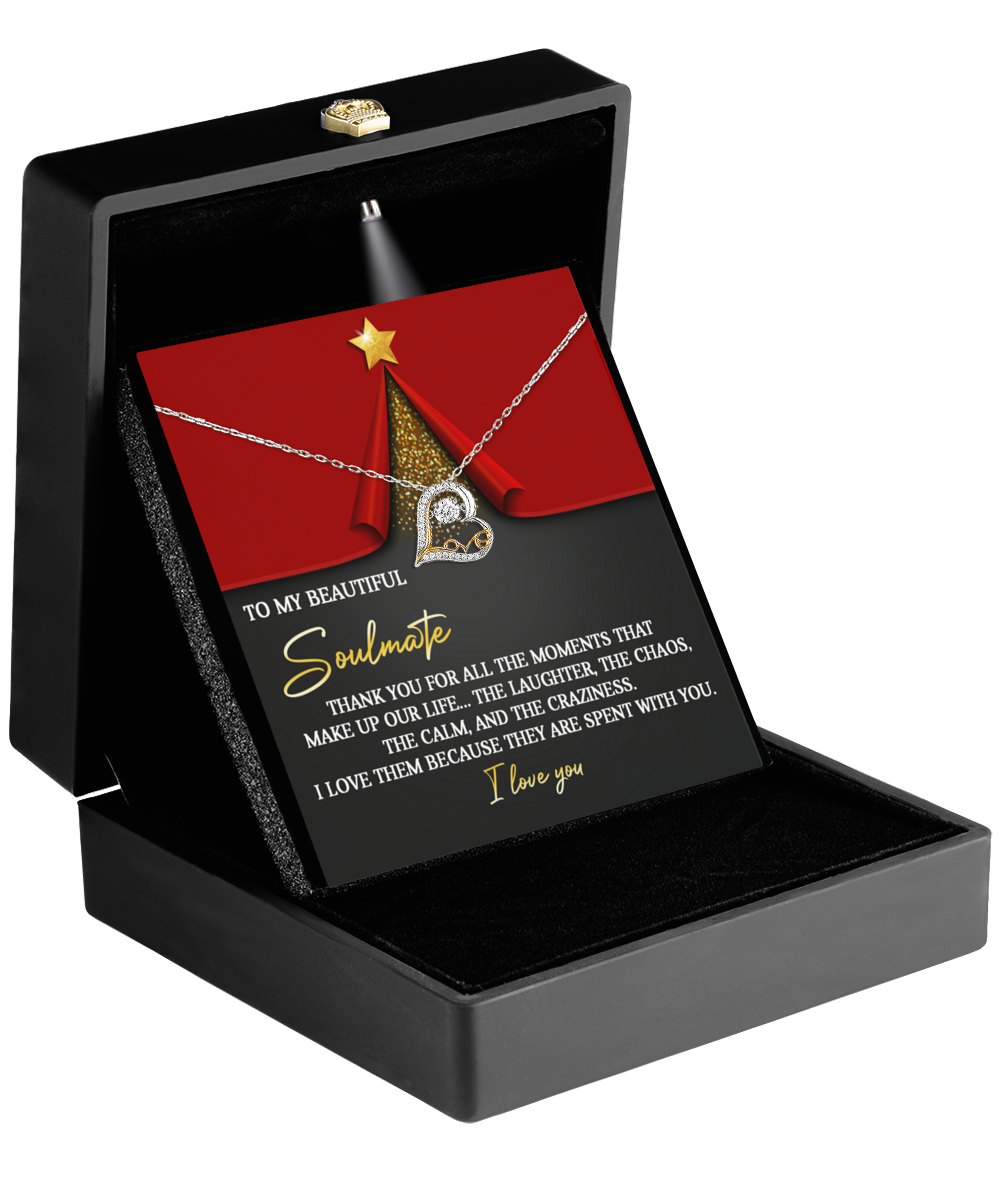 Open black box to reveal a breathtaking Soulmate-The Moments - Love Dancing Necklace in sterling silver, accompanied by a card with a heartfelt message for your soulmate.