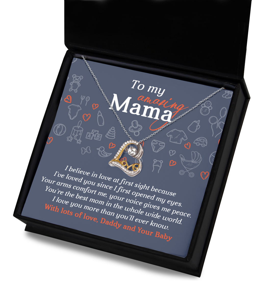 A 14k gold necklace presented in a box with a tender message: "To my amazing Mama. With lots of love, Daddy and Your Baby." The "To Mom To Be, At First Sight - Love Dancing Necklace" beautifully captures the essence of maternal love.