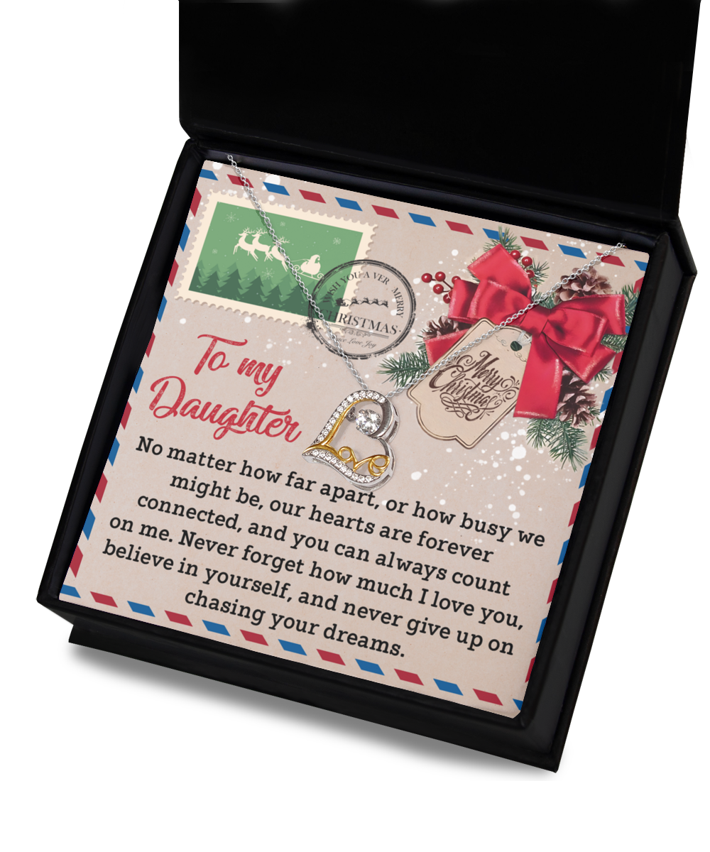 A decorative card with a heartfelt message to a daughter, featuring festive Christmas graphics and the Daughter-Forever Connected - Love Dancing Necklace in 14k gold, elegantly nestled in a black box.