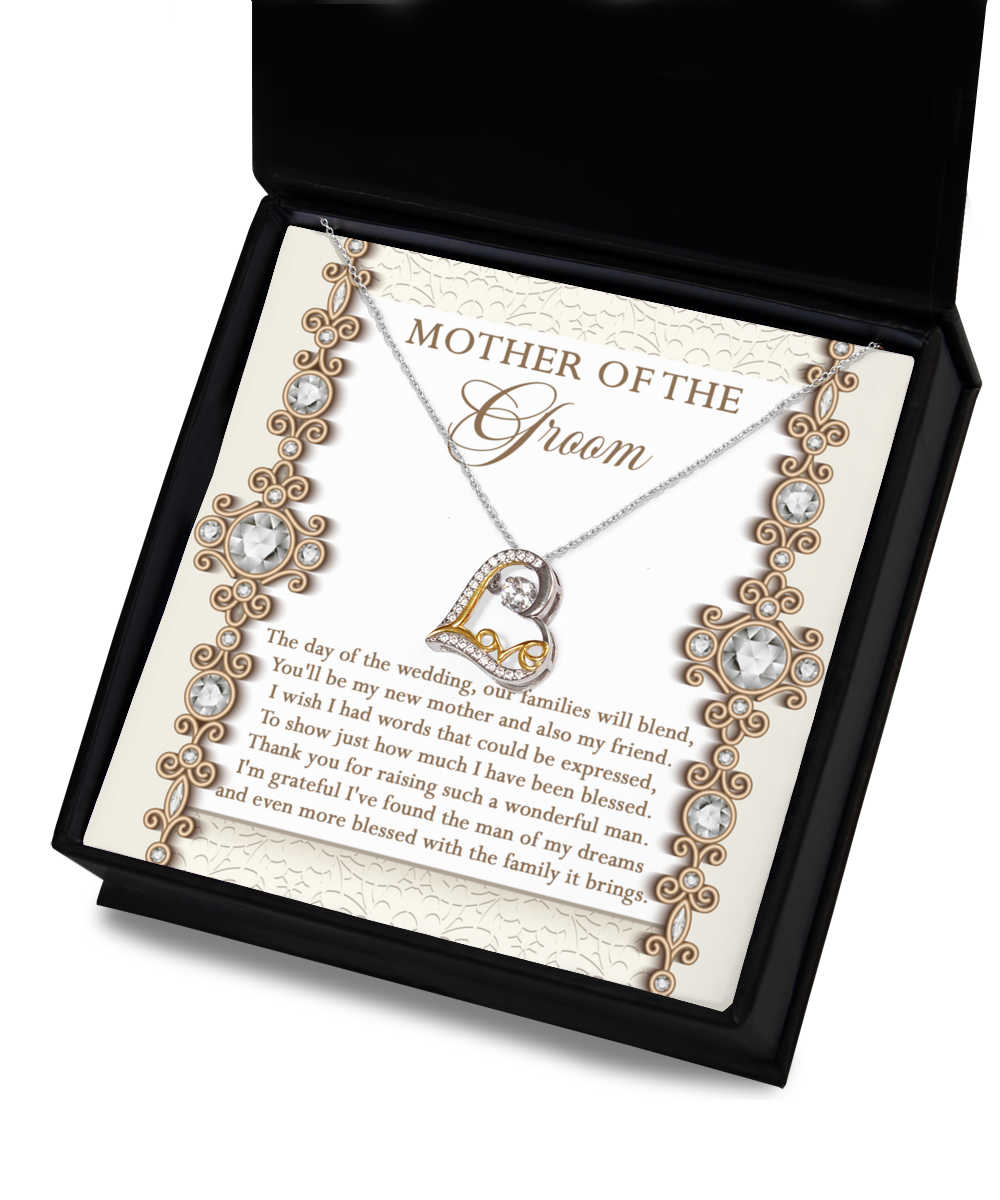 A Mom Of Groom-New Mother - Love Dancing Necklace with a sterling silver chain and a pendant is displayed on a decorative card inside an open black box. The card reads "Mother of the Groom" and includes an emotional message expressing gratitude.