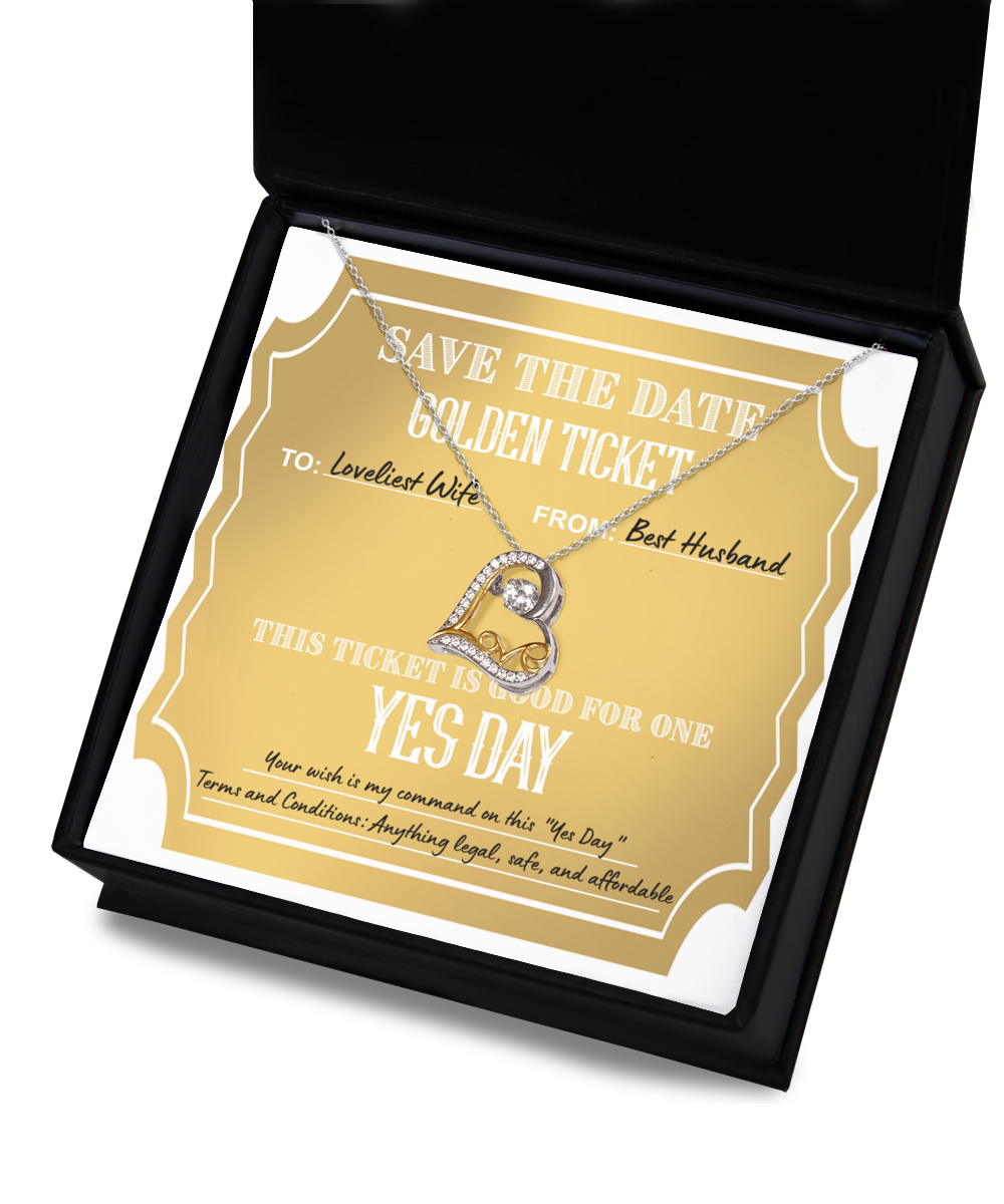 A "To Wife-Golden Ticket - Love Dancing Necklace" in a gift box on top of a golden ticket reading: "Save the Date. Golden Ticket. To: Loveliest Wife, From: Best Husband. This 14k gold plated ticket is good for one Yes Day.