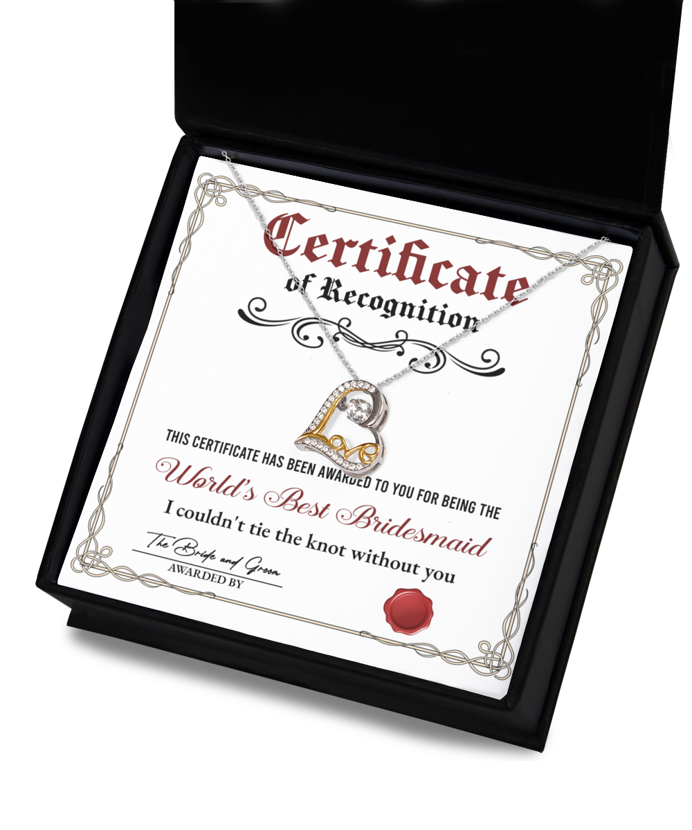 A certificate of recognition for the "World's Best Bridesmaid" displayed in a box with a stunning .925 sterling silver heart-shaped necklace, triple-plated in 14k gold. The certificate expresses heartfelt gratitude for her unwavering support during the wedding. Product Name: To Bridesmaid, Certificate Of Recognition - Love Dancing Necklace