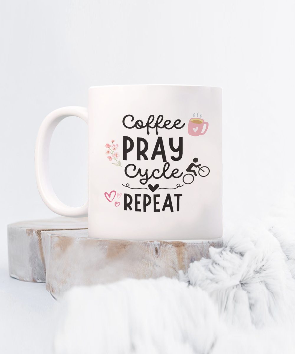 This charming white "Coffee Pray Cycle Repeat" mug, decorated with a cup, bicycle, and heart icons, is a Limited Time online exclusive. Enjoy safe checkout for this unique piece not available in stores. Product Name: Coffee Pray Cycle Repeat Coffee Mug | Best Gift Ideas And Appreciation Cup For Cyclist.